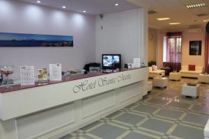 a lobby of a dental office with a reception counter at Hotel Santa Marta in Pozzuoli
