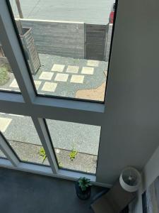 an overhead view of a room with a window at Modern 2-Home Private Oasis w Pool Hot Tub in DT in Austin