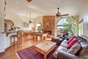 a living room with a couch and a table at Stunning Sedona Views Spa, Firepit and Stargazing in Sedona
