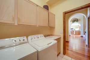 a kitchen with a washer and dryer in it at Stunning Sedona Views Spa, Firepit and Stargazing in Sedona +21 photos
