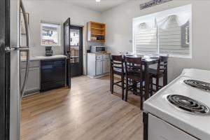 a kitchen and dining room with a table and chairs at Cozy Retreat in Historic Indianapolis Neighborhood Close to Downtown in Indianapolis