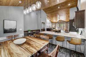 a kitchen with a table and chairs in a room at Luxury Modern Townhome-Private Hot Tub-In Town in Breckenridge