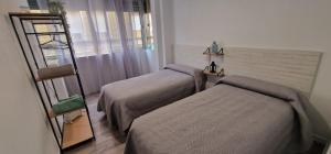 Cama o camas de una habitación en Evangelista59