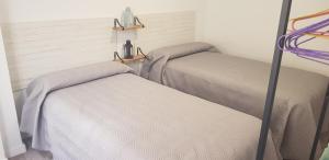 Cama o camas de una habitación en Evangelista59