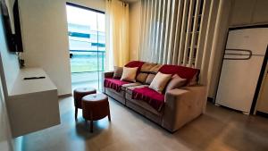 Posezení v ubytování Apartamento a 500mt do mar, perto do Beto Carrero, com ar condicionado