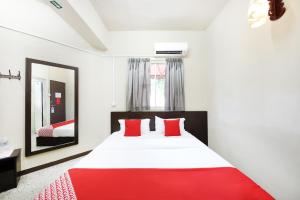 Postel nebo postele na pokoji v ubytování OYO 507 Aikka Hotel