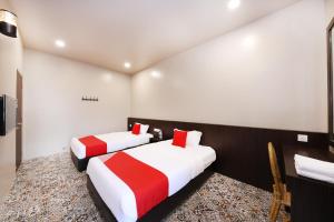 Postel nebo postele na pokoji v ubytování OYO 507 Aikka Hotel