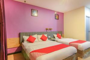 Postel nebo postele na pokoji v ubytování Super OYO 43930 Hotel Esplanade