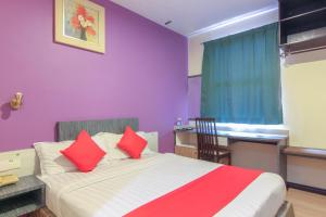 Postel nebo postele na pokoji v ubytování Super OYO 43930 Hotel Esplanade