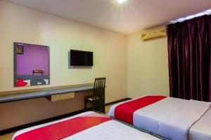 Postel nebo postele na pokoji v ubytování Super OYO 43930 Hotel Esplanade