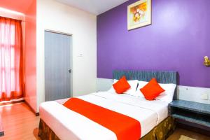 Postel nebo postele na pokoji v ubytování Super OYO 43930 Hotel Esplanade