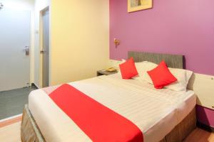 Postel nebo postele na pokoji v ubytování Super OYO 43930 Hotel Esplanade