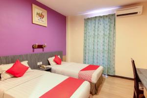 Postel nebo postele na pokoji v ubytování Super OYO 43930 Hotel Esplanade