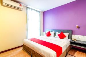 Postel nebo postele na pokoji v ubytování Super OYO 43930 Hotel Esplanade