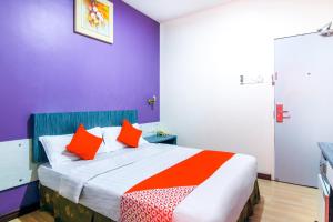 Postel nebo postele na pokoji v ubytování Super OYO 43930 Hotel Esplanade