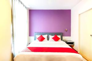 Postel nebo postele na pokoji v ubytování Super OYO 43930 Hotel Esplanade
