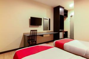 Postel nebo postele na pokoji v ubytování Super OYO 43930 Hotel Esplanade