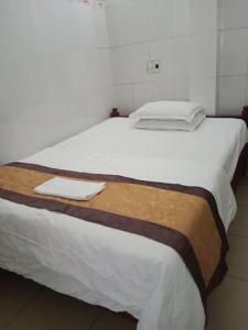 Postel nebo postele na pokoji v ubytování SPOT ON 1188 Motel Hoa Cam