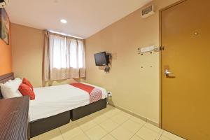 Postel nebo postele na pokoji v ubytování OYO 90732 New Hotel 33