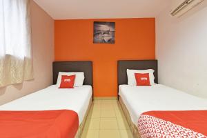 Postel nebo postele na pokoji v ubytování OYO 90732 New Hotel 33