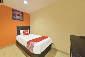 Postel nebo postele na pokoji v ubytování OYO 90732 New Hotel 33