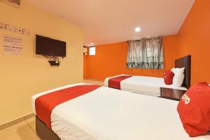 TV a/nebo společenská místnost v ubytování OYO 90732 New Hotel 33