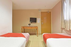 Postel nebo postele na pokoji v ubytování OYO 90732 New Hotel 33