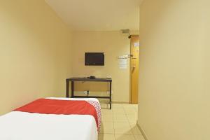 TV a/nebo společenská místnost v ubytování OYO 90732 New Hotel 33