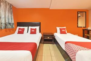 Postel nebo postele na pokoji v ubytování OYO 90732 New Hotel 33