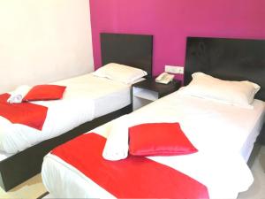 Letto o letti in una camera di OYO 91087 Hotel Dspark Port Klang