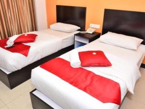 Letto o letti in una camera di OYO 91087 Hotel Dspark Port Klang