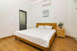Giường trong phòng chung tại SPOT ON 806 Net Viet Homestay