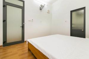 Giường trong phòng chung tại SPOT ON 806 Net Viet Homestay