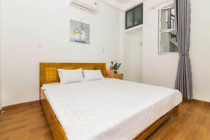 Giường trong phòng chung tại SPOT ON 806 Net Viet Homestay