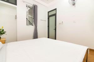 Giường trong phòng chung tại SPOT ON 806 Net Viet Homestay