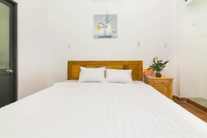 Giường trong phòng chung tại SPOT ON 806 Net Viet Homestay