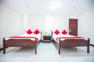 Postel nebo postele na pokoji v ubytování OYO 236 Hotel Edmundo
