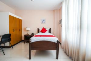 Postel nebo postele na pokoji v ubytování OYO 236 Hotel Edmundo