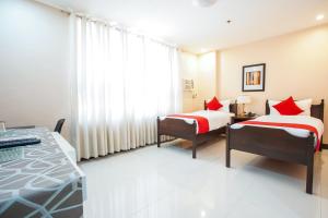 Postel nebo postele na pokoji v ubytování OYO 236 Hotel Edmundo