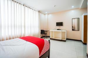 Postel nebo postele na pokoji v ubytování OYO 236 Hotel Edmundo