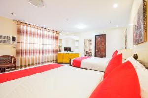 Postel nebo postele na pokoji v ubytování OYO 236 Hotel Edmundo
