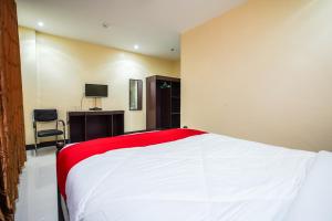 Postel nebo postele na pokoji v ubytování OYO 236 Hotel Edmundo
