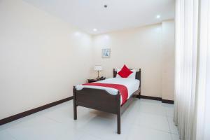 Postel nebo postele na pokoji v ubytování OYO 236 Hotel Edmundo