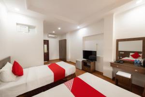 Postel nebo postele na pokoji v ubytování Super OYO Capital O 387 Bach Duong Hotel