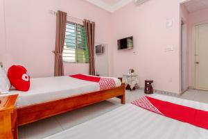 Postel nebo postele na pokoji v ubytování OYO 962 Tulip Motel + 20 fotografií