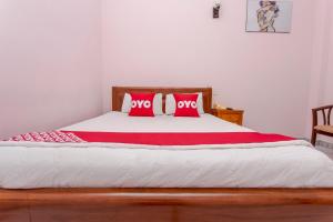 Postel nebo postele na pokoji v ubytování OYO 962 Tulip Motel