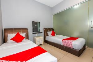 Postel nebo postele na pokoji v ubytování OYO 1185 Ho Hotel