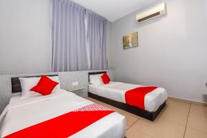 Postel nebo postele na pokoji v ubytování OYO 1185 Ho Hotel