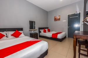 Postel nebo postele na pokoji v ubytování OYO 1185 Ho Hotel