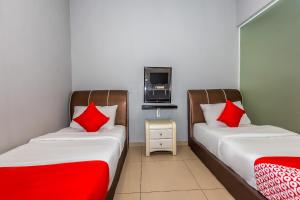 Postel nebo postele na pokoji v ubytování OYO 1185 Ho Hotel